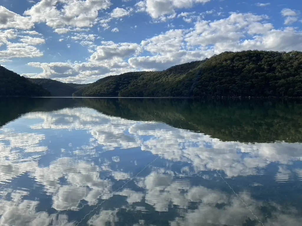 Clouds mirrored in the still bay
